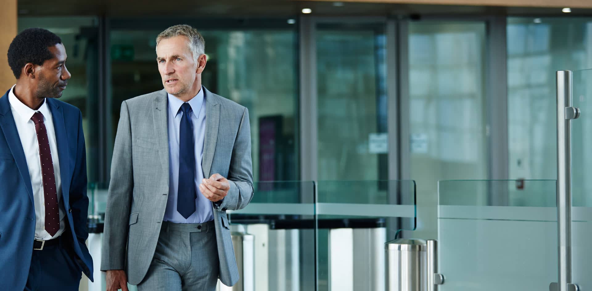 Business professionals walking in hallway