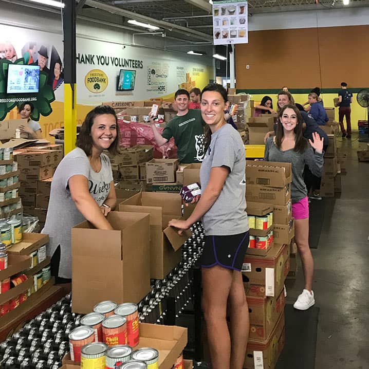Fort Washington Associates packing boxes at the Freestore Foodbank