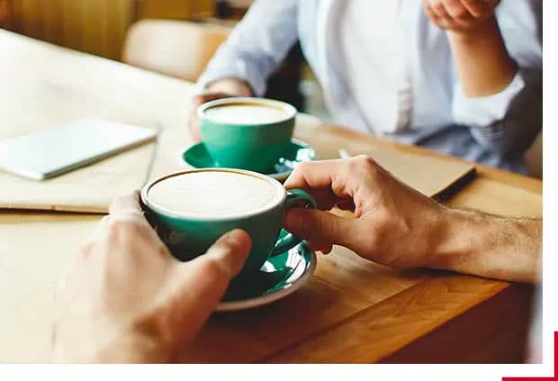 advice seeker confiding in friend with tea