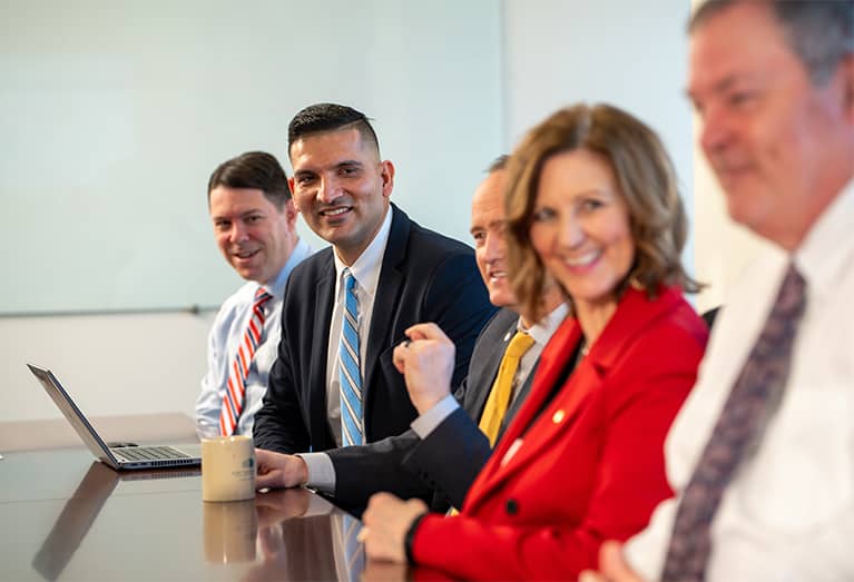 Associates meeting at table