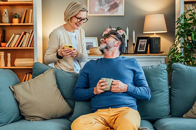 Couple discussing finances on the couch
