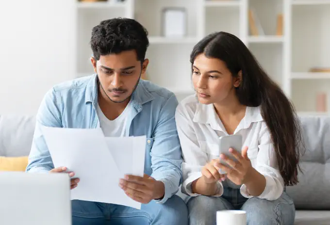Couple reviewing finances and life insurance needs together