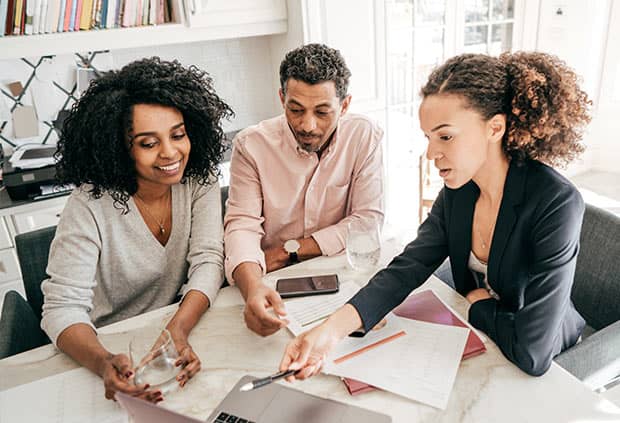 financial professional assisting couple in financial planning