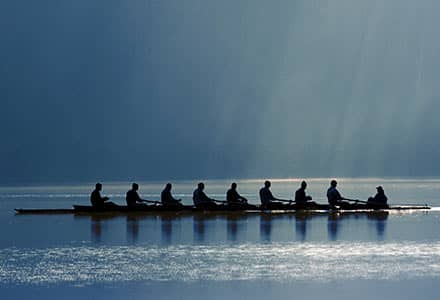 Competitive rowers in a boat