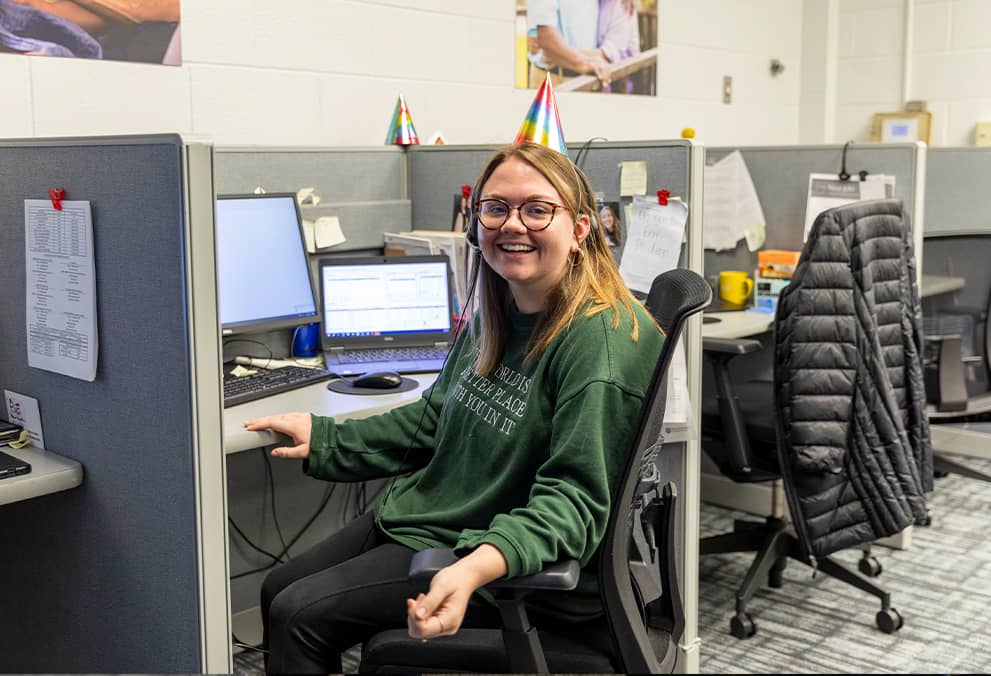 Associate sitting at her desk at the NKU Call Center