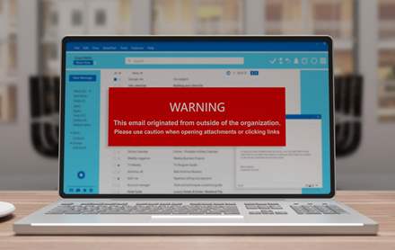 Email message warning user about using caution when opening an email from an outside organization.