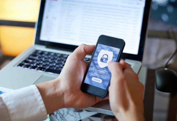 Person holding cellphone with security app open