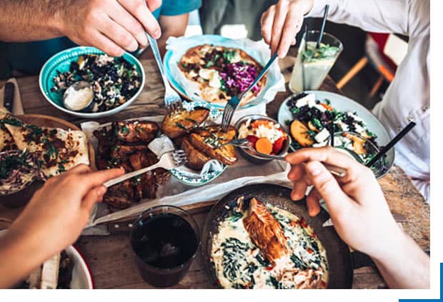 prideful explorer community with friends eating dinner