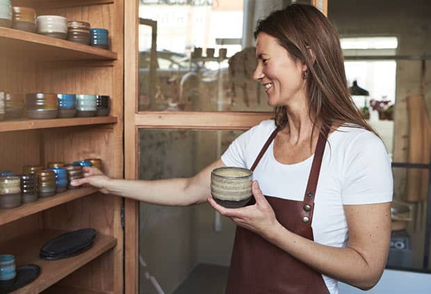 small business owner stocking shelves