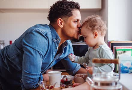 Happy dad with daughter knowing he is financially Strong