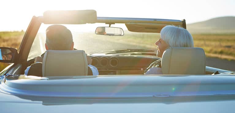 couple driving down the road