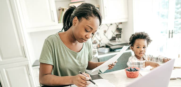 Mother researching life insurance options