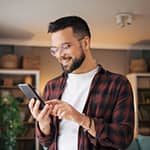 Young man purchasing term life on his phone