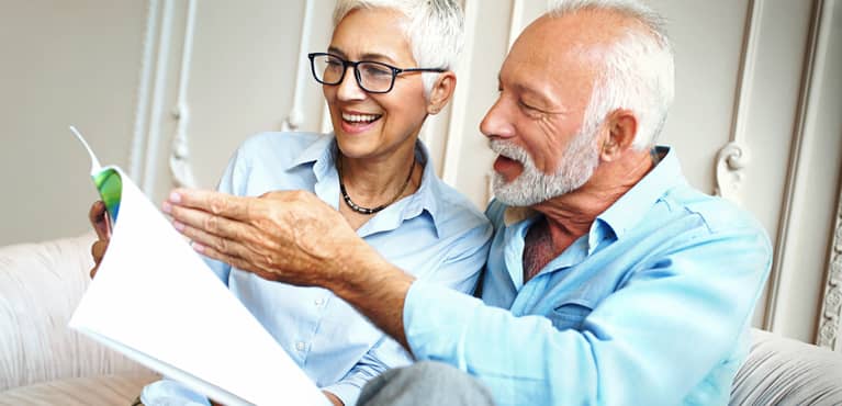 retired couple with paperwork