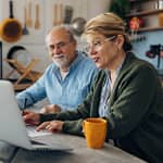 Senior couple reviewing expenses
