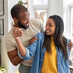 Couple holding their new house keys