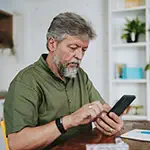 Man looking up how to buy insurance on his phone