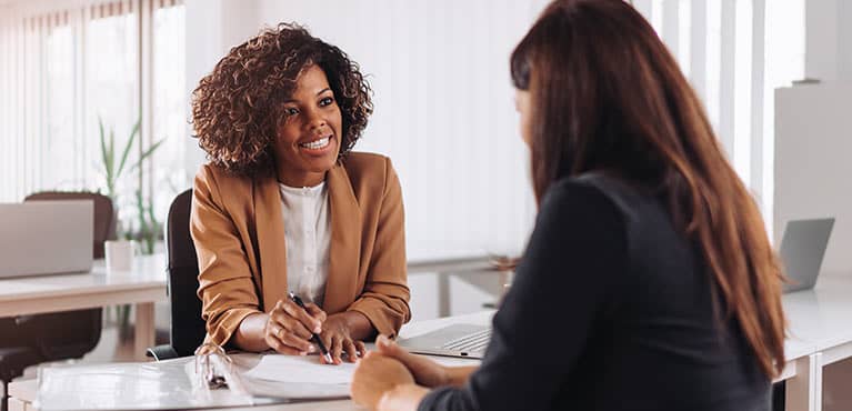 Woman discussing life insurance with her advisor