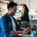 Married man researching lifetime income options on computer