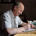 Man writing on notepad