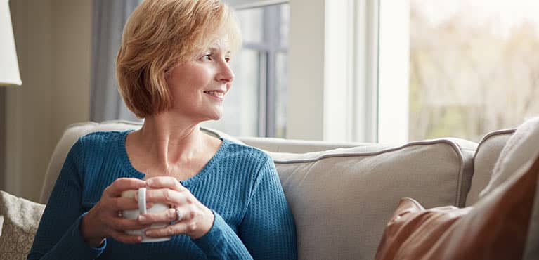 woman staring out window