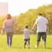 Couple walking with son in a park