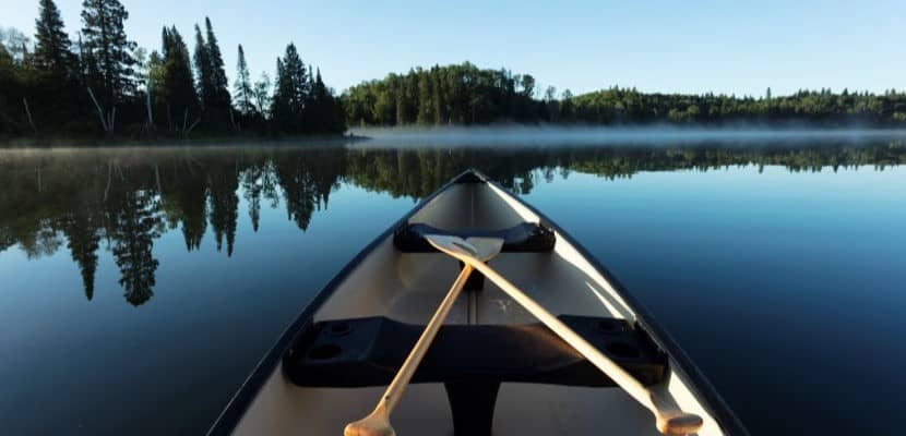 Canoeing in calm water.
