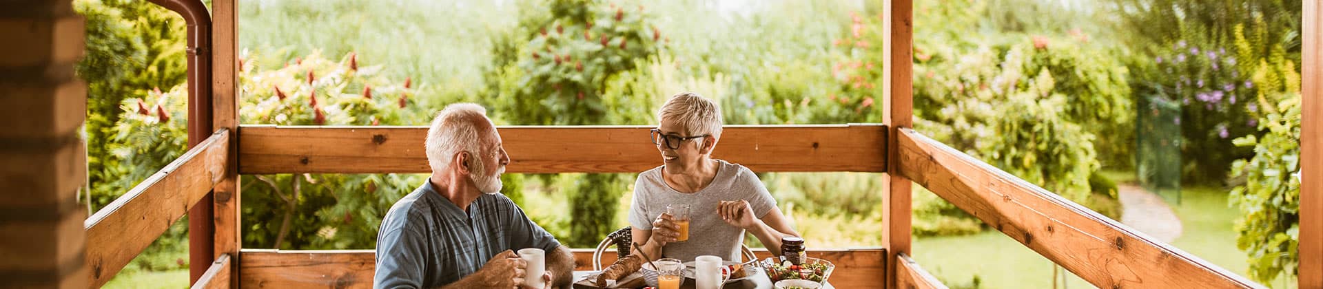 couple enjoying breakfast outside