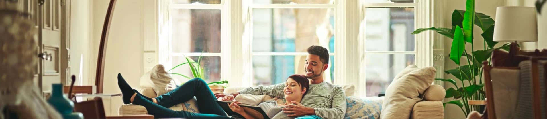 couple on couch discussing life insurance