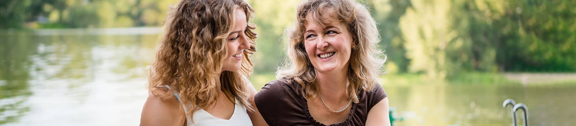 mother daughter by lake