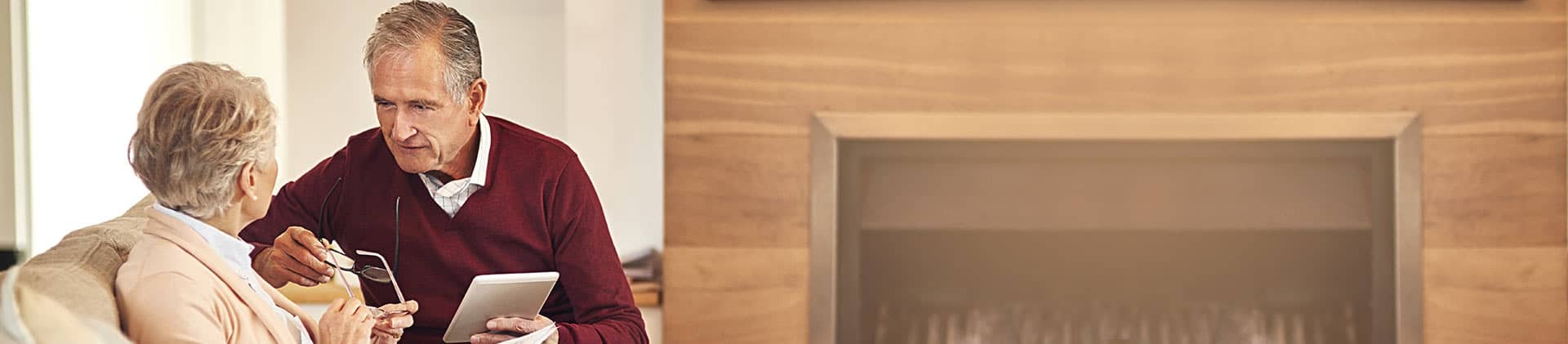 older couple looking at investment options