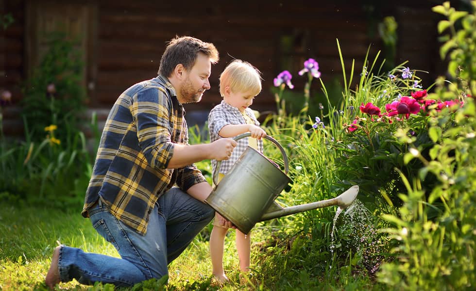 Father and son working in garden together