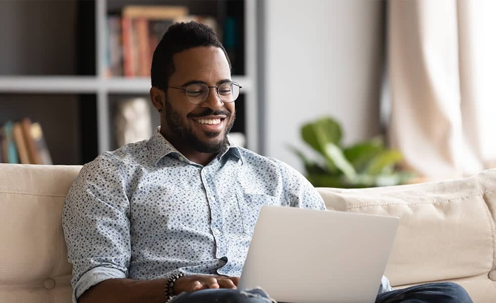 man reading mail on his computer