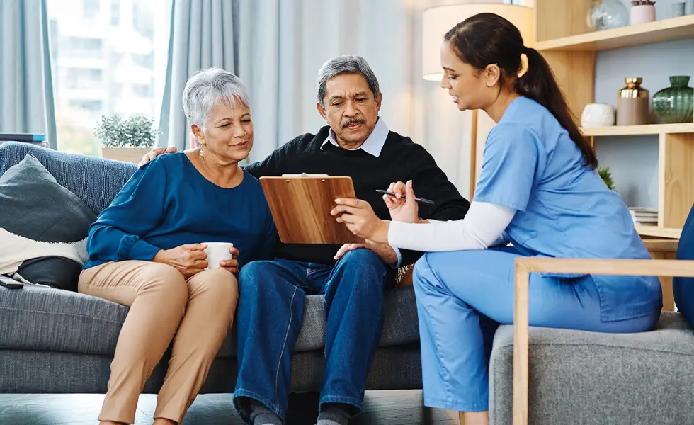 Married couple meeting with a nurse