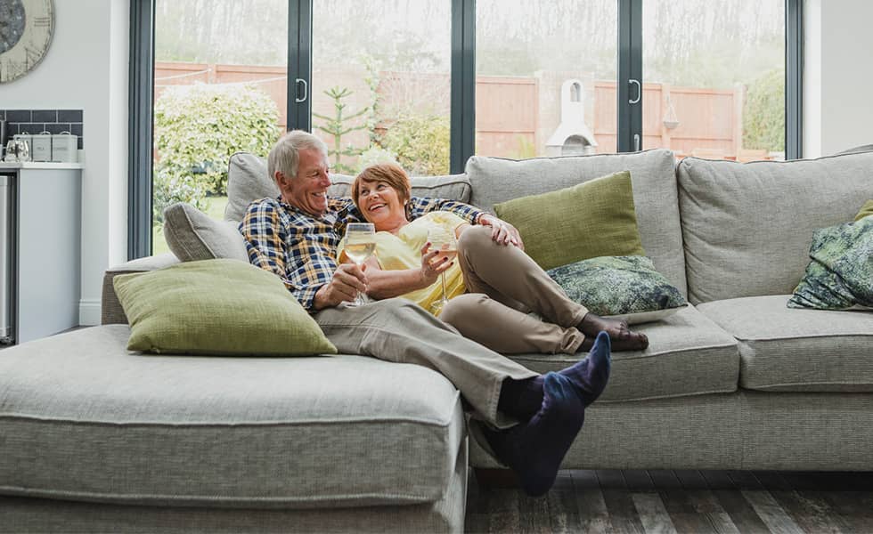 Retired couple relaxing on the couch together