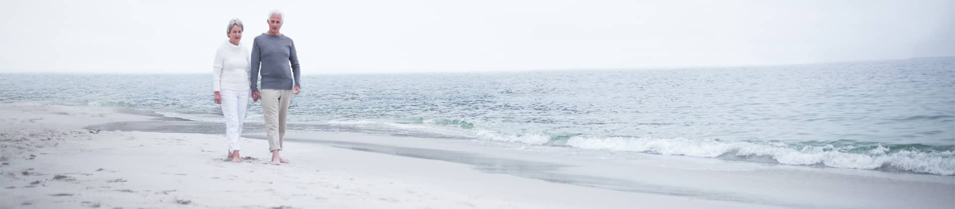 Couple walking together on beach