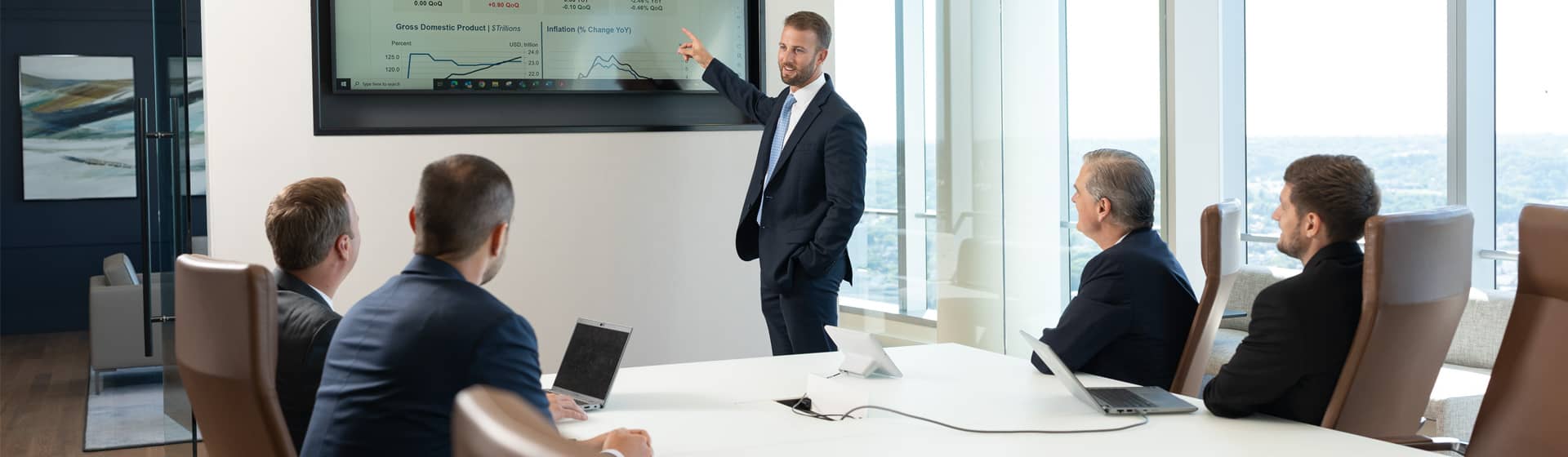 Eagle associates sitting in conference room meeting together