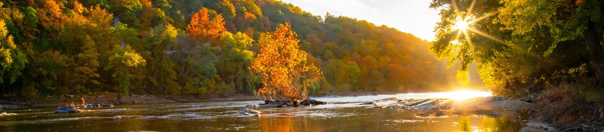 sunset in autumn over river