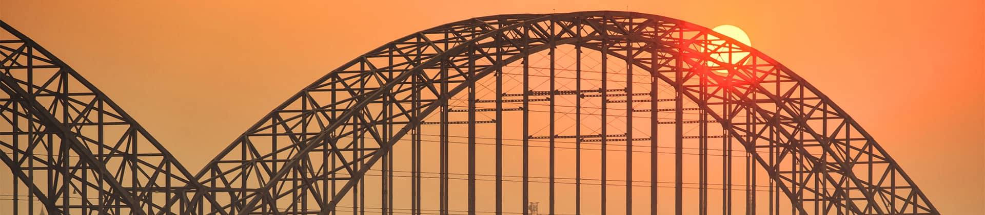 Sunset behind bridge
