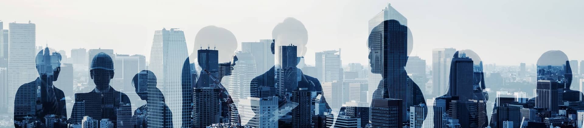 workers transposed over city skyline