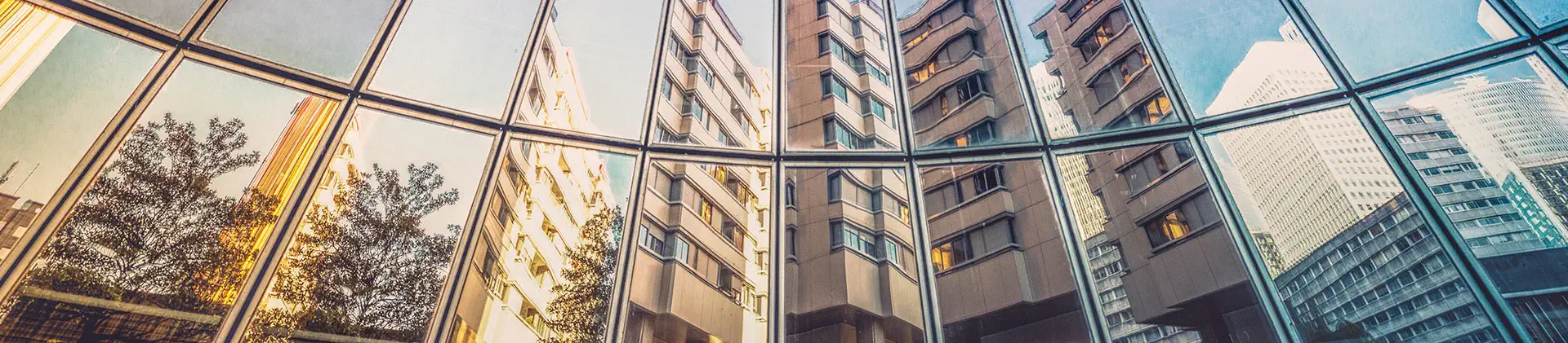 city reflection in windows