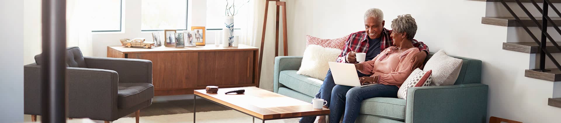 couple discussing finances on the couch