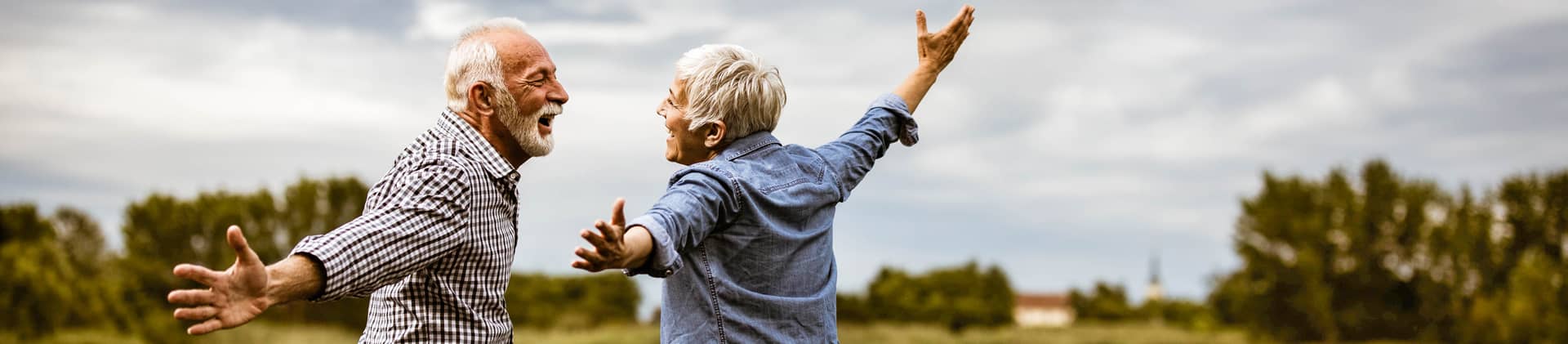 older couple on dock celebrating