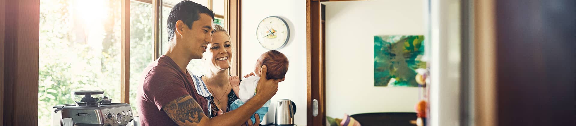 family admiring new baby protected with term life insurance