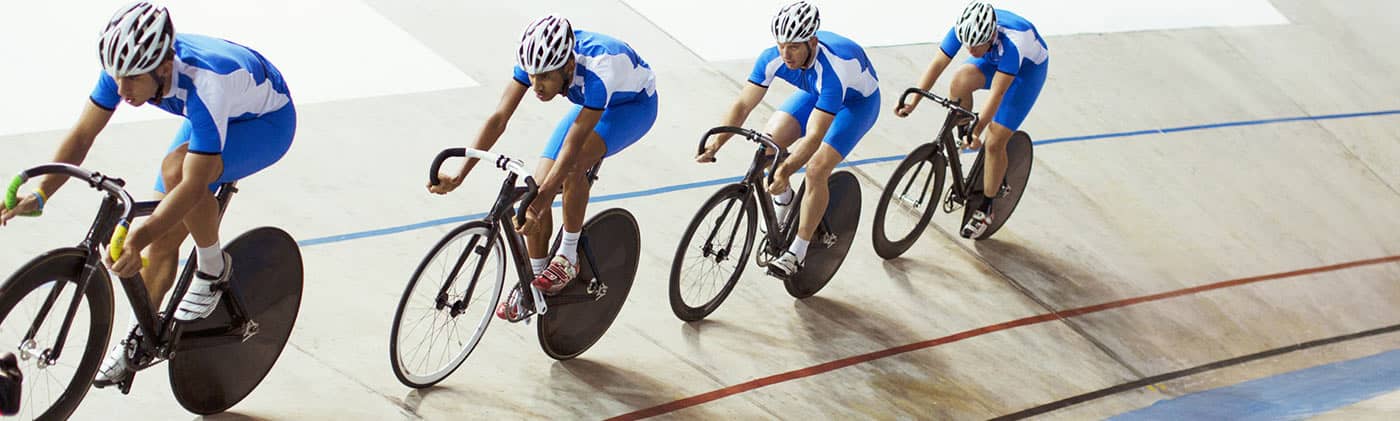 Cyclists in velodrome racing