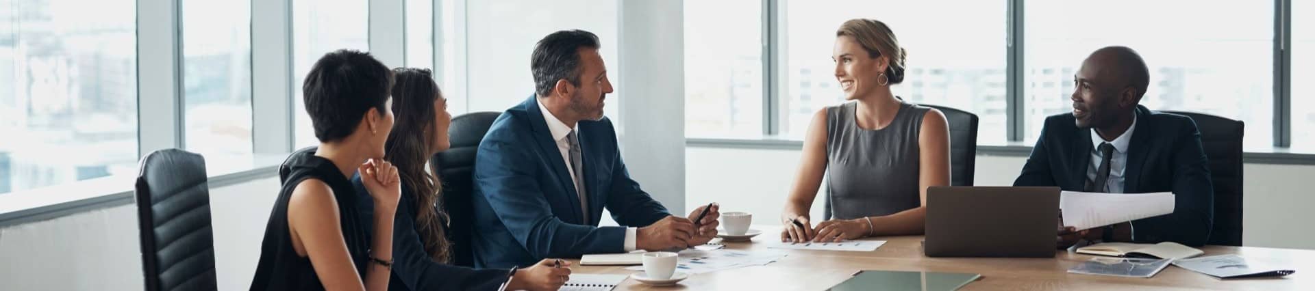 Boardroom, corporate and business people in a meeting planning company growth strategy and brainstorming ideas. Team, collaboration and professional colleagues and executives talking innovation.