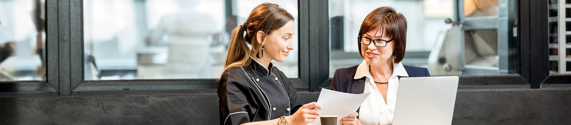 business owner and employee discuss retirement options