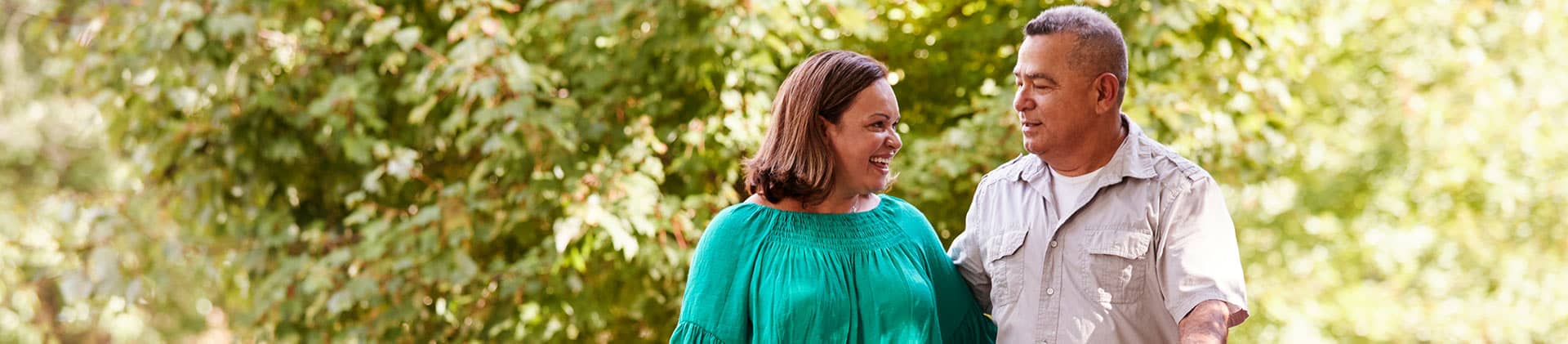 A couple enjoying a walk outside on a nice sunny day
