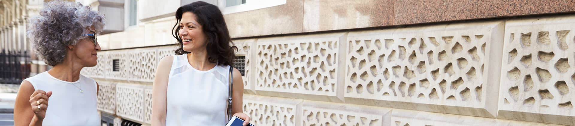 Two women enjoying a walk on the street