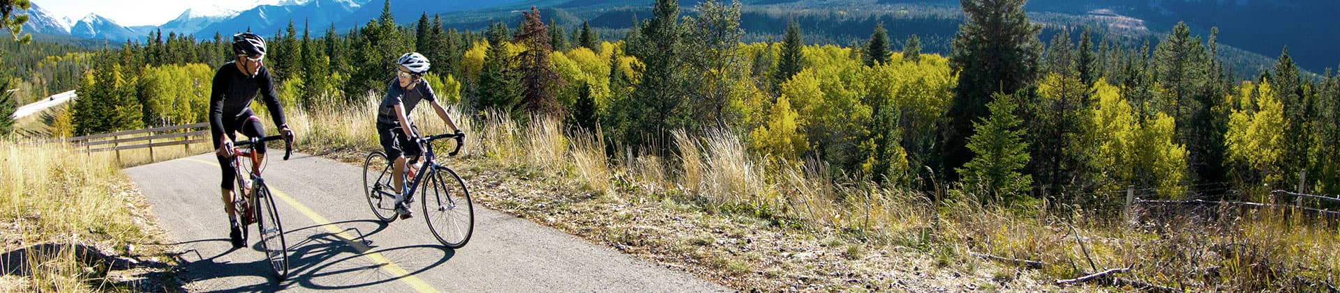 man and woman biking in the mountains and discussing multirate single premium deferred annuity and annuities